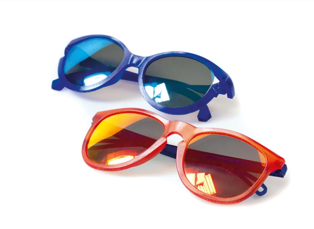 Blue and red SLA eyewear prototypes with fitted lenses