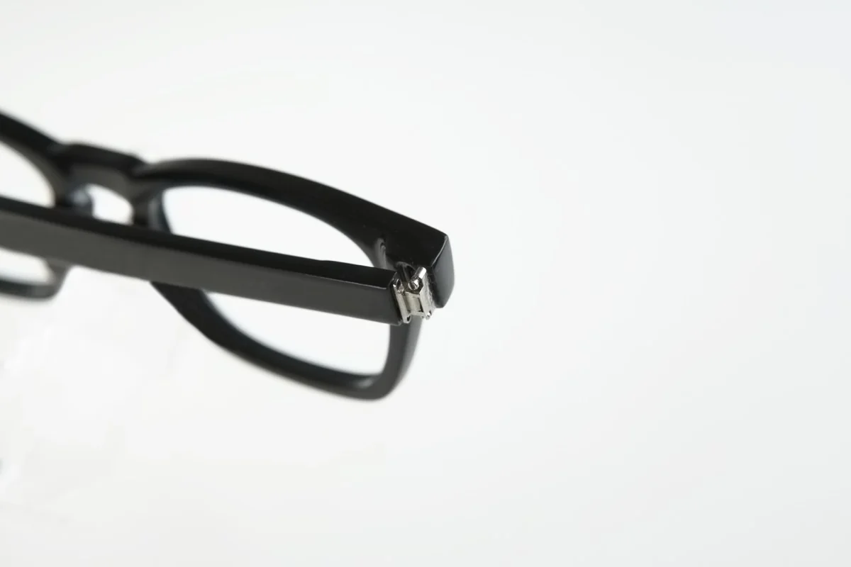 Detail of a black eyewear prototype temple hinge