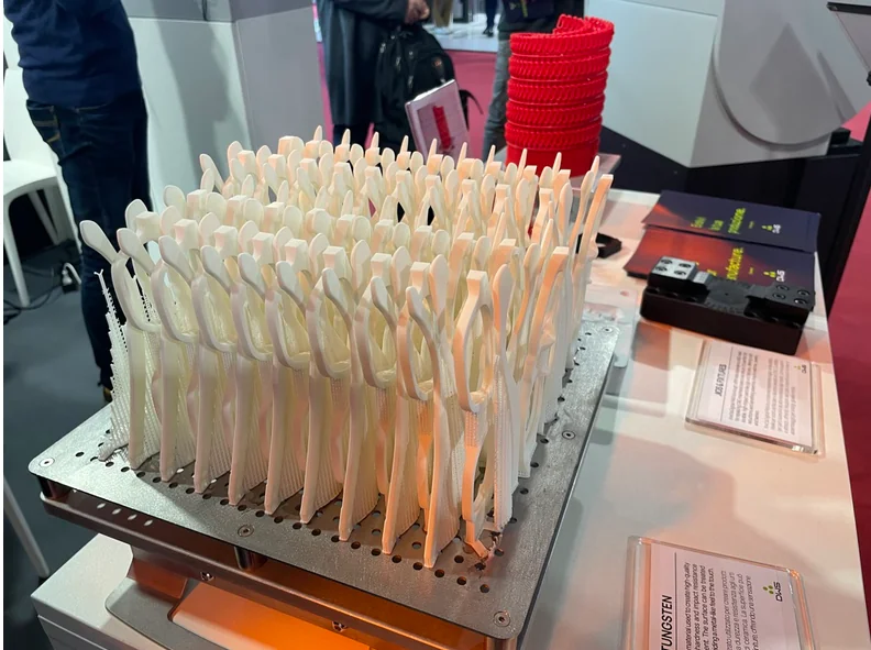Batch of SLA eyewear frames arranged on a production platform